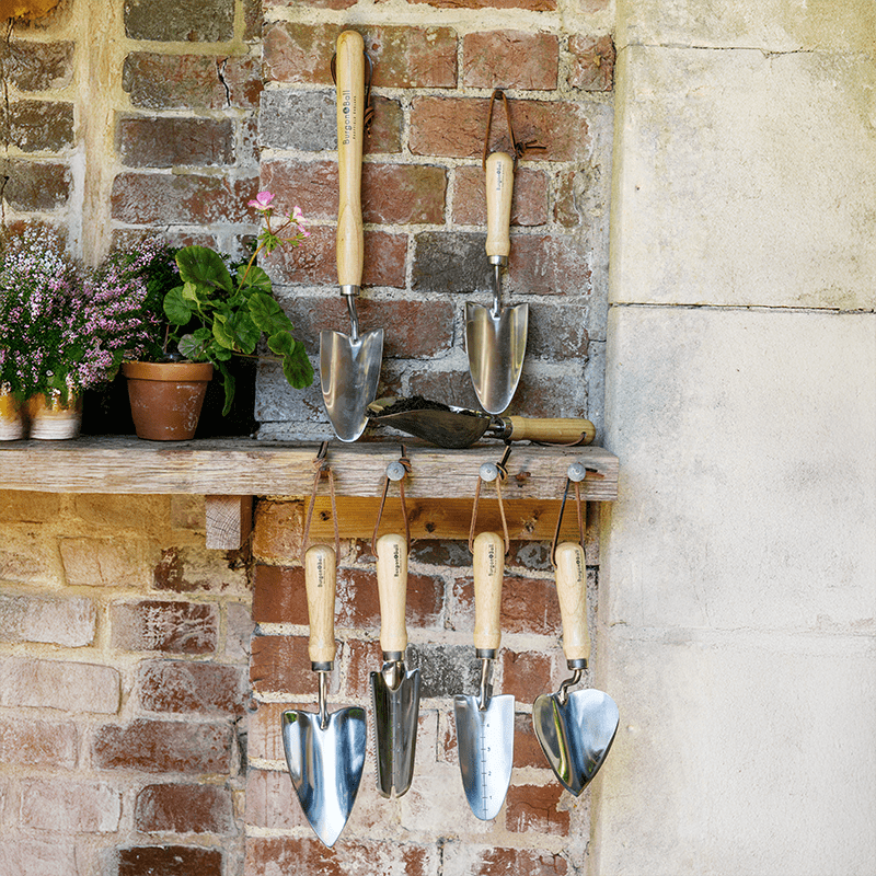 Burgon and Ball RHS Endorsed gardening tools hanging up outside